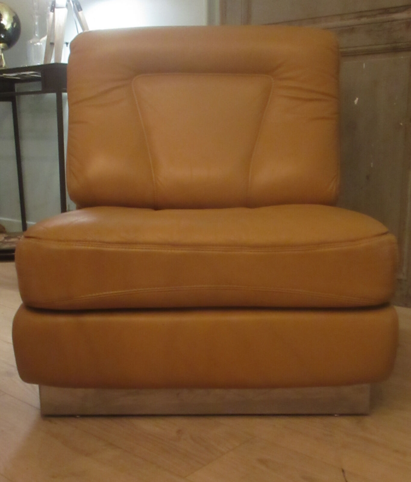 Leather armchair, stainless steel base, 70s