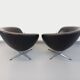 Pair of vintage Scandinavian swivel armchairs in faux leather and chrome.