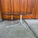 Coffee oval table with metal legs and smoky glass top, 1990s