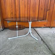 Coffee oval table with metal legs and smoky glass top, 1990s
