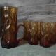 Pitcher and its glasses in amber glass