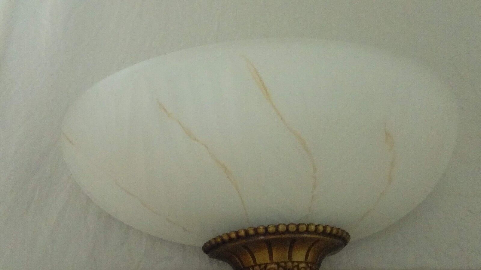 Pair of wall sconces in glass paste and brass