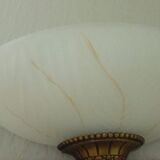 Pair of wall sconces in glass paste and brass