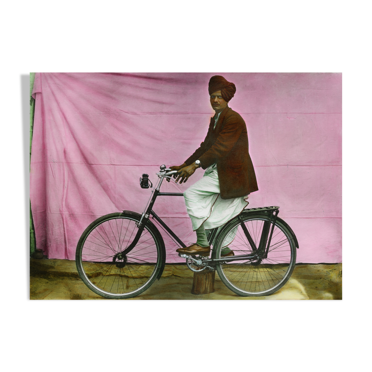 Portrait of a man on his bike, Rajasthan around 1920, old colored photograph
