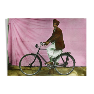 Portrait of a man on his bike, Rajasthan around 1920, old colored photograph