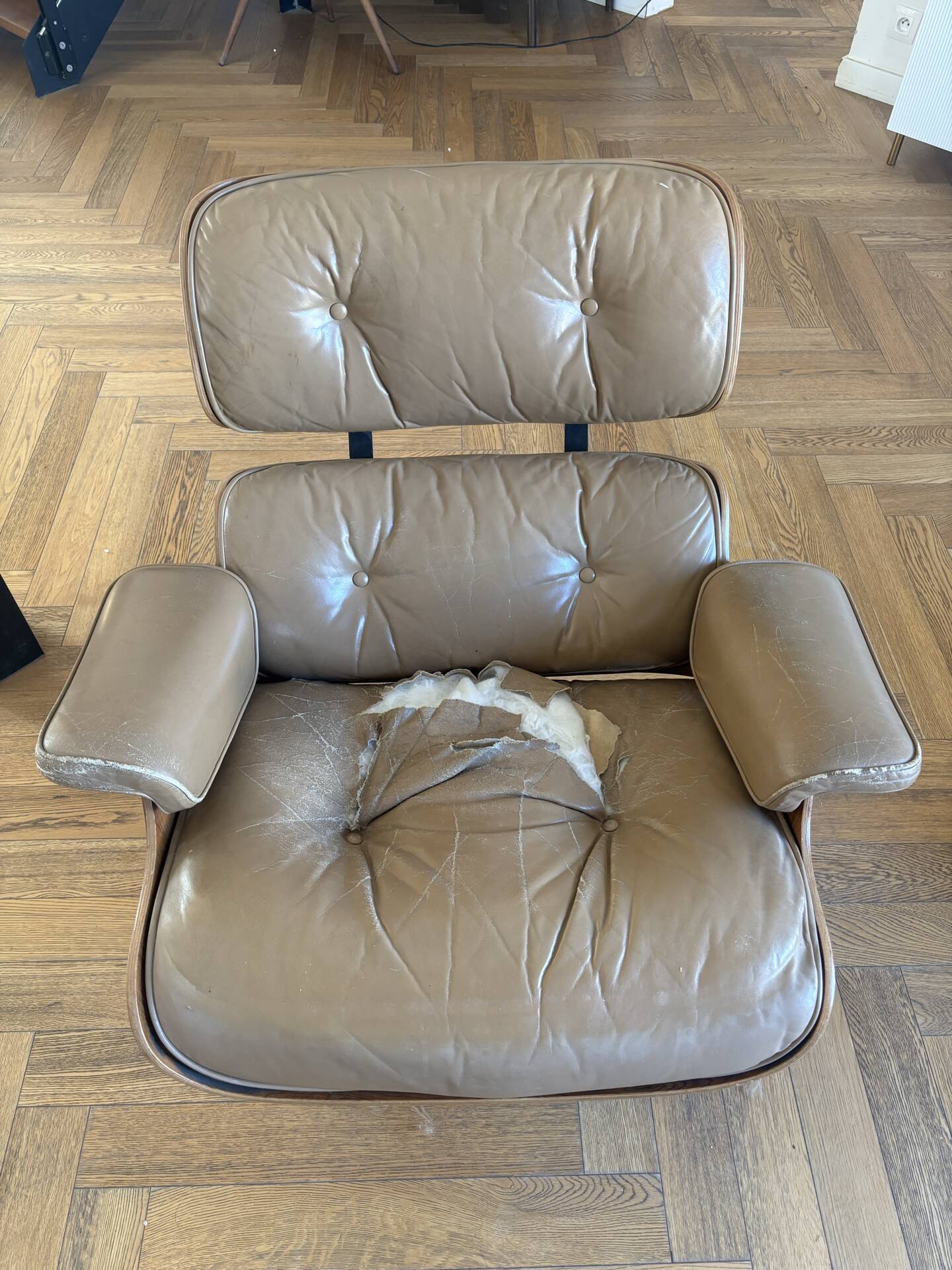 Armchairs and footrests by Charles & Ray Eames
