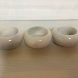 9 marble candle holders of different sizes