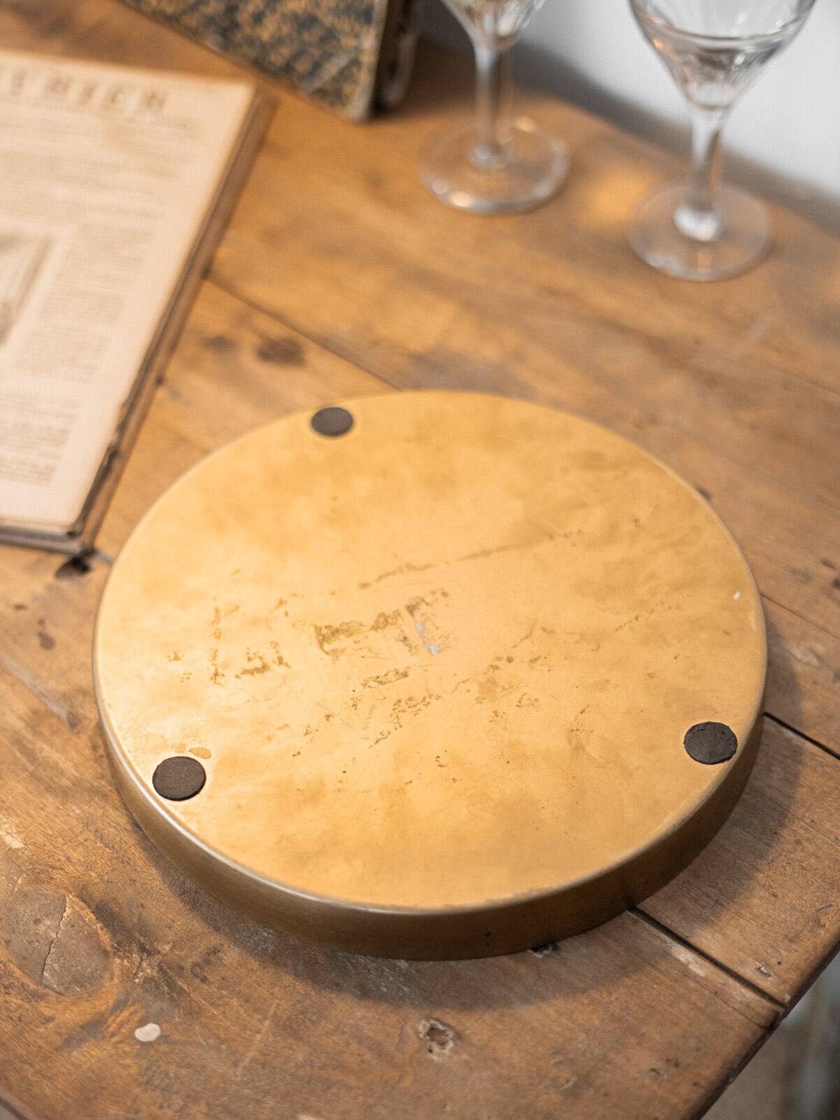 Patinated mirrored top and brass