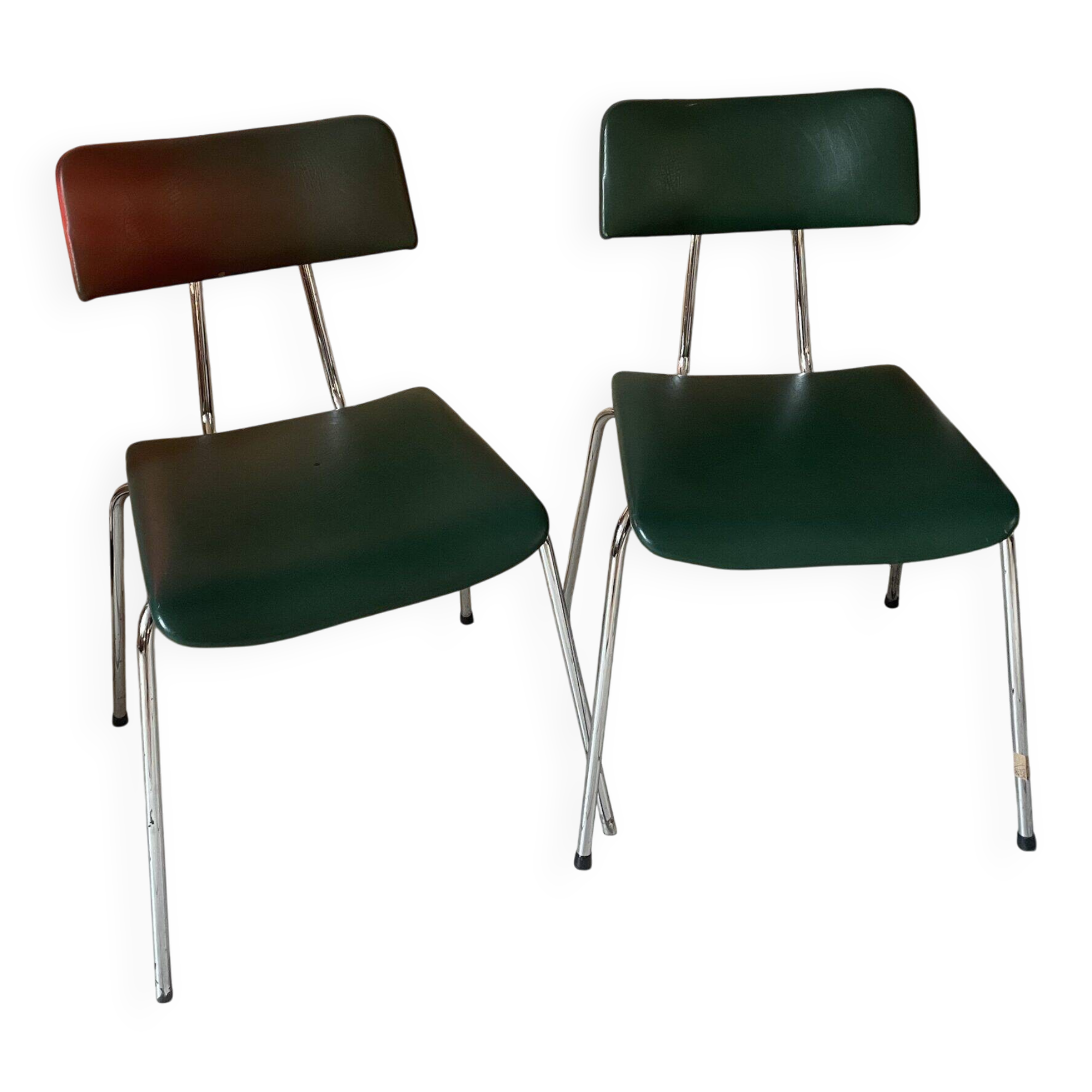Pair of green faux leather chairs