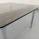Vintage square coffee table in smoked glass and chrome metal from the 1970s.