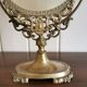 Oval mirror on psyche stand