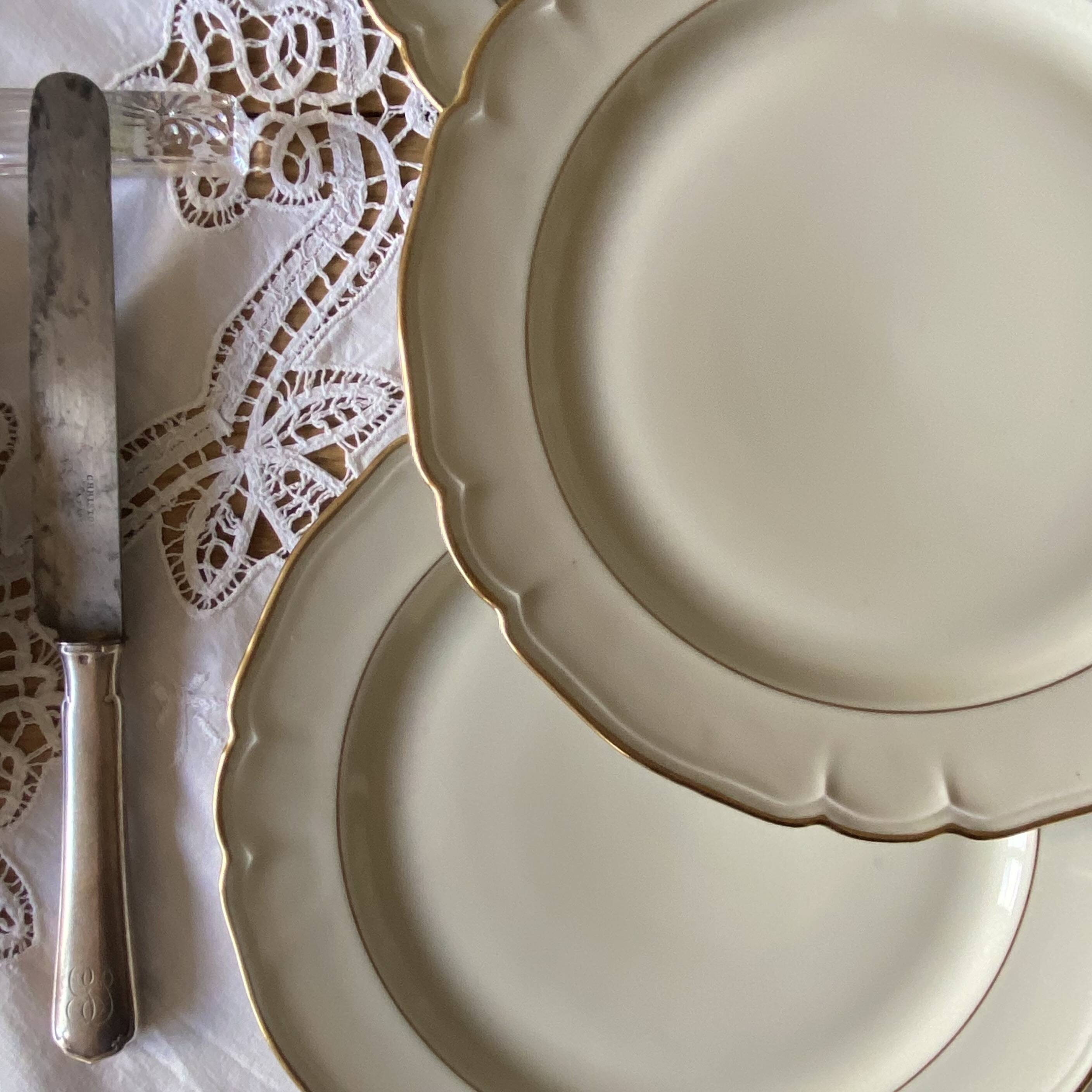 Set of 6 antique off-white porcelain dinner plates with gold trim