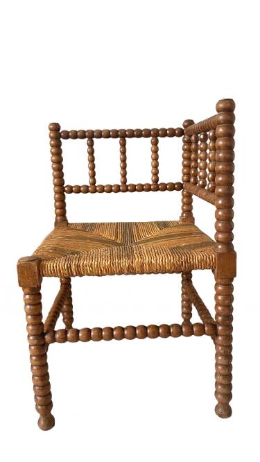 Corner chair in straw and turned wood, fireside chair.