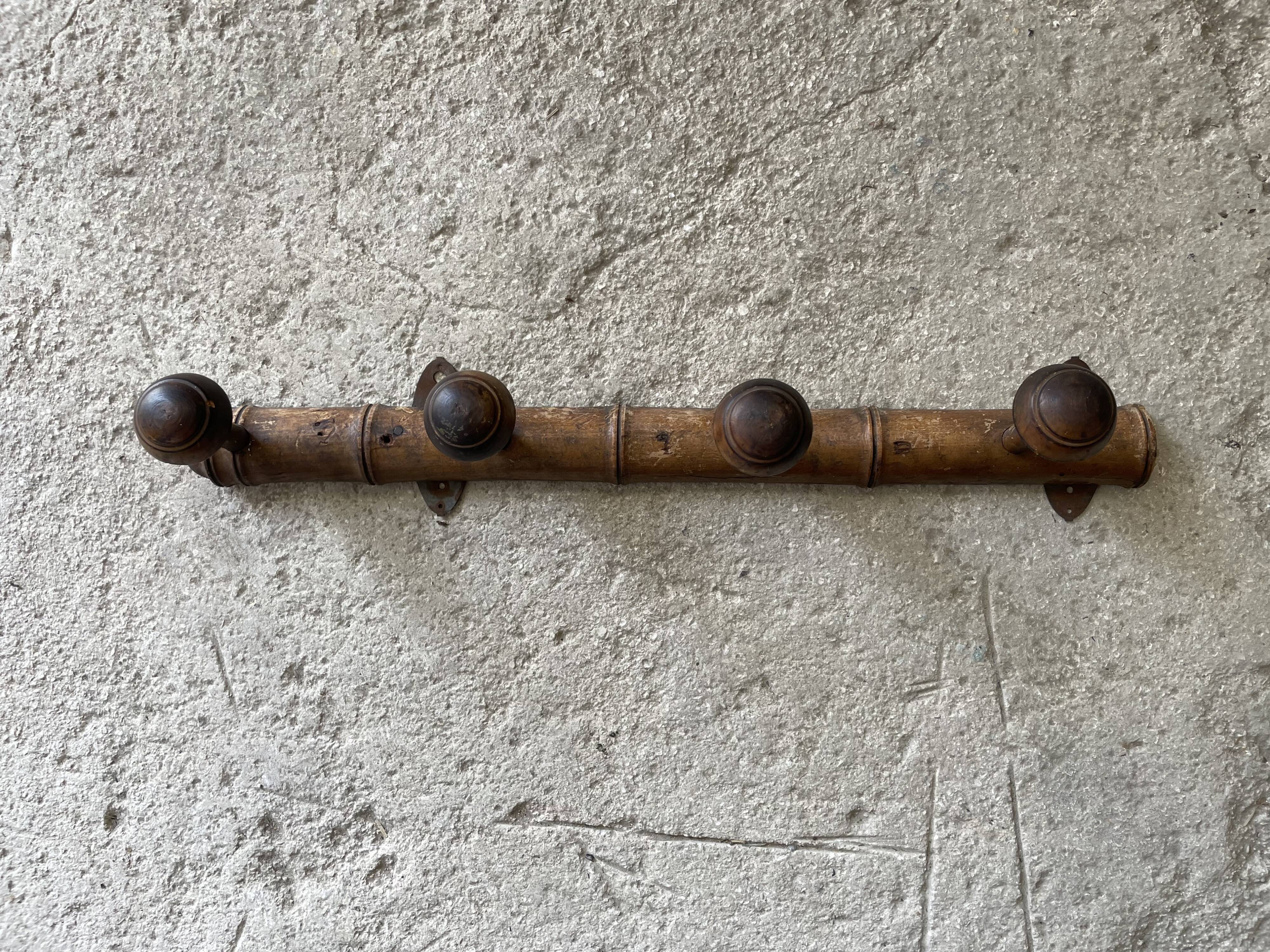 Old wooden wall coat rack