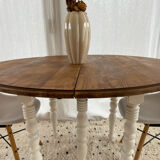 Extendable round table in raw and white wood