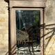Imposing fireplace mirror in carved and painted wood, 19th century.