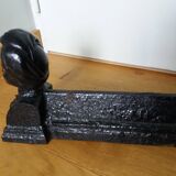 Cast iron andirons with character heads