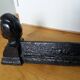 Cast iron andirons with character heads