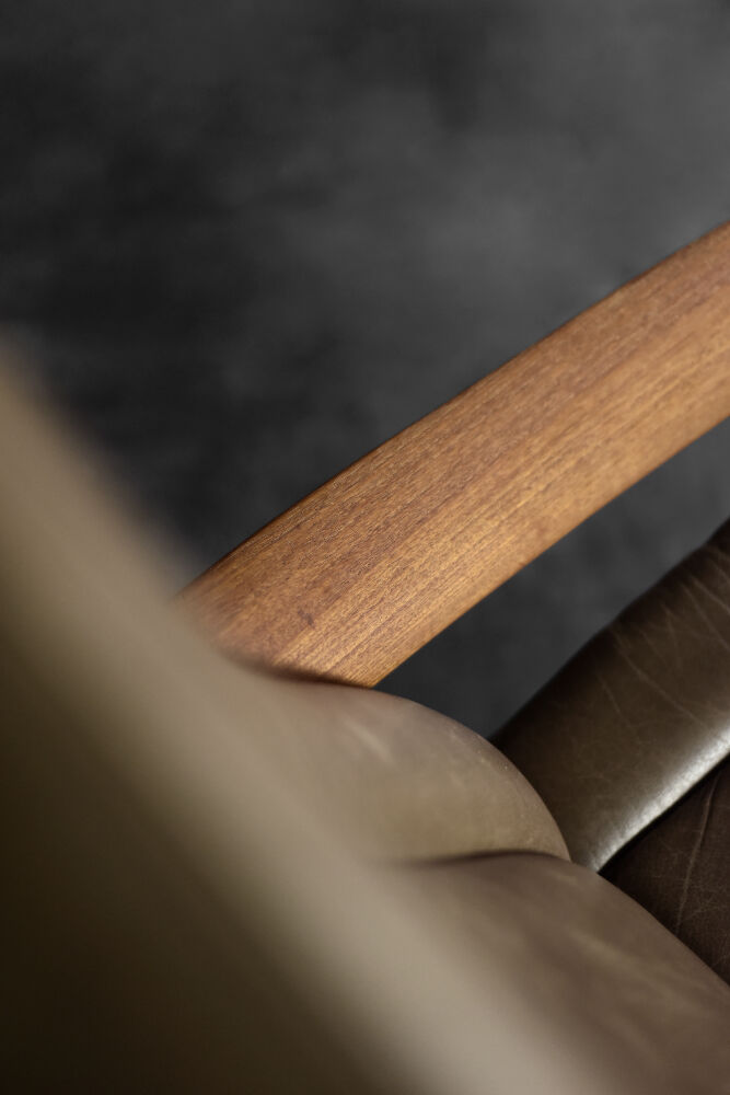 High teak and brown leather armchair with reclining backrest, mid-century Danish style, 1960s.