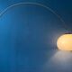 Vintage Guzzini Space Age arc floor lamp with white mushroom shade and marble base