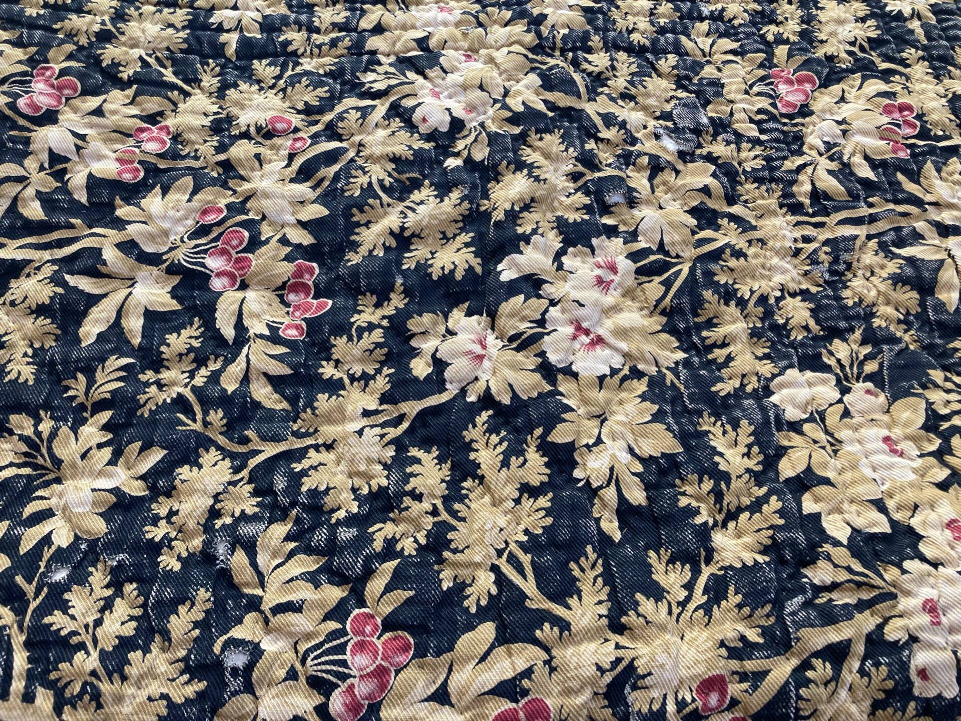Antique hand-stitched boutis bedspread, floral fabric, 19th century.