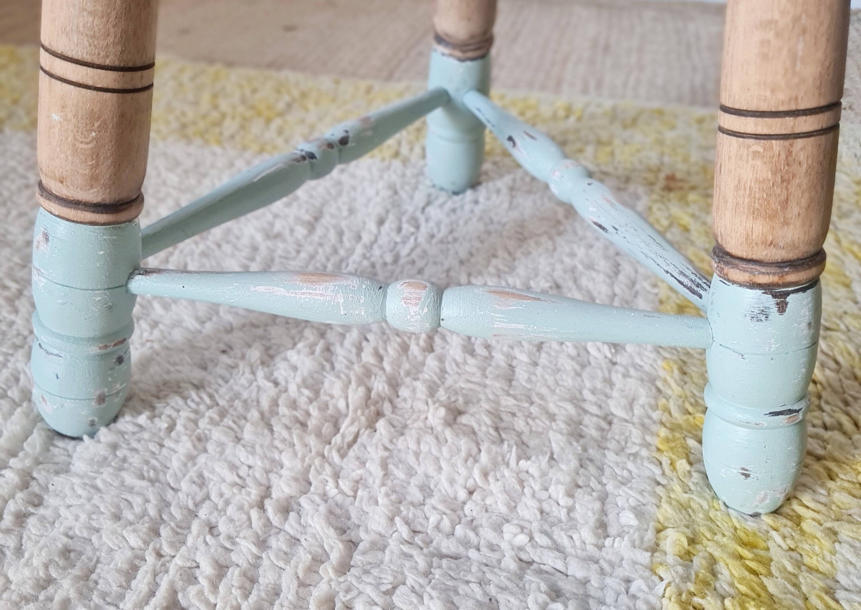 Antique tripod stool with striped seat