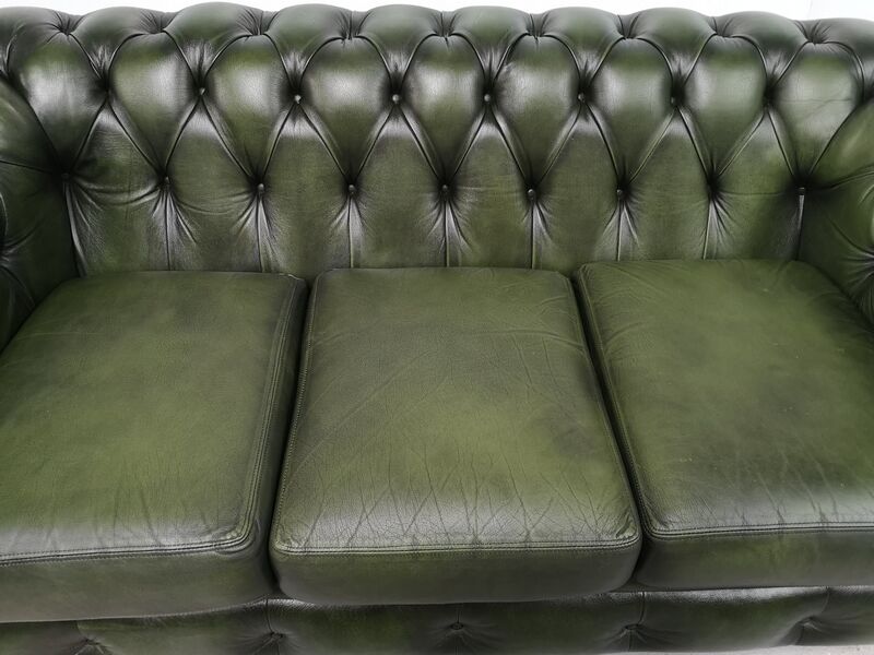 Three-seater green leather Chesterfield sofa