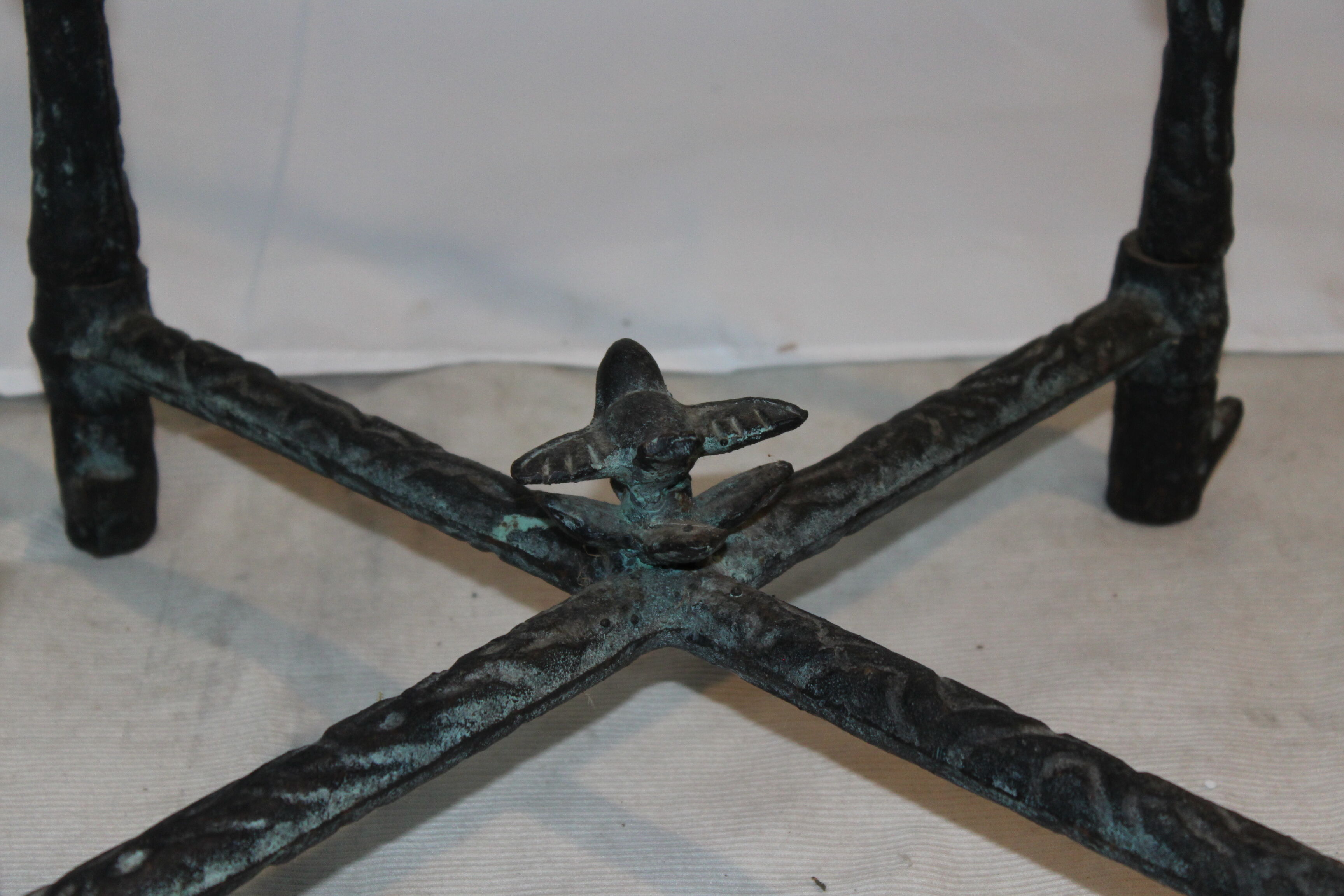 Giacometti style cast iron table, glass table