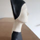 Bust of a woman in anthracite and white plaster