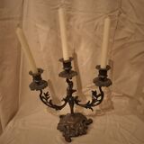 Antique metal candlestick with three branches