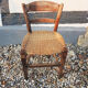 Old woven straw children's chair