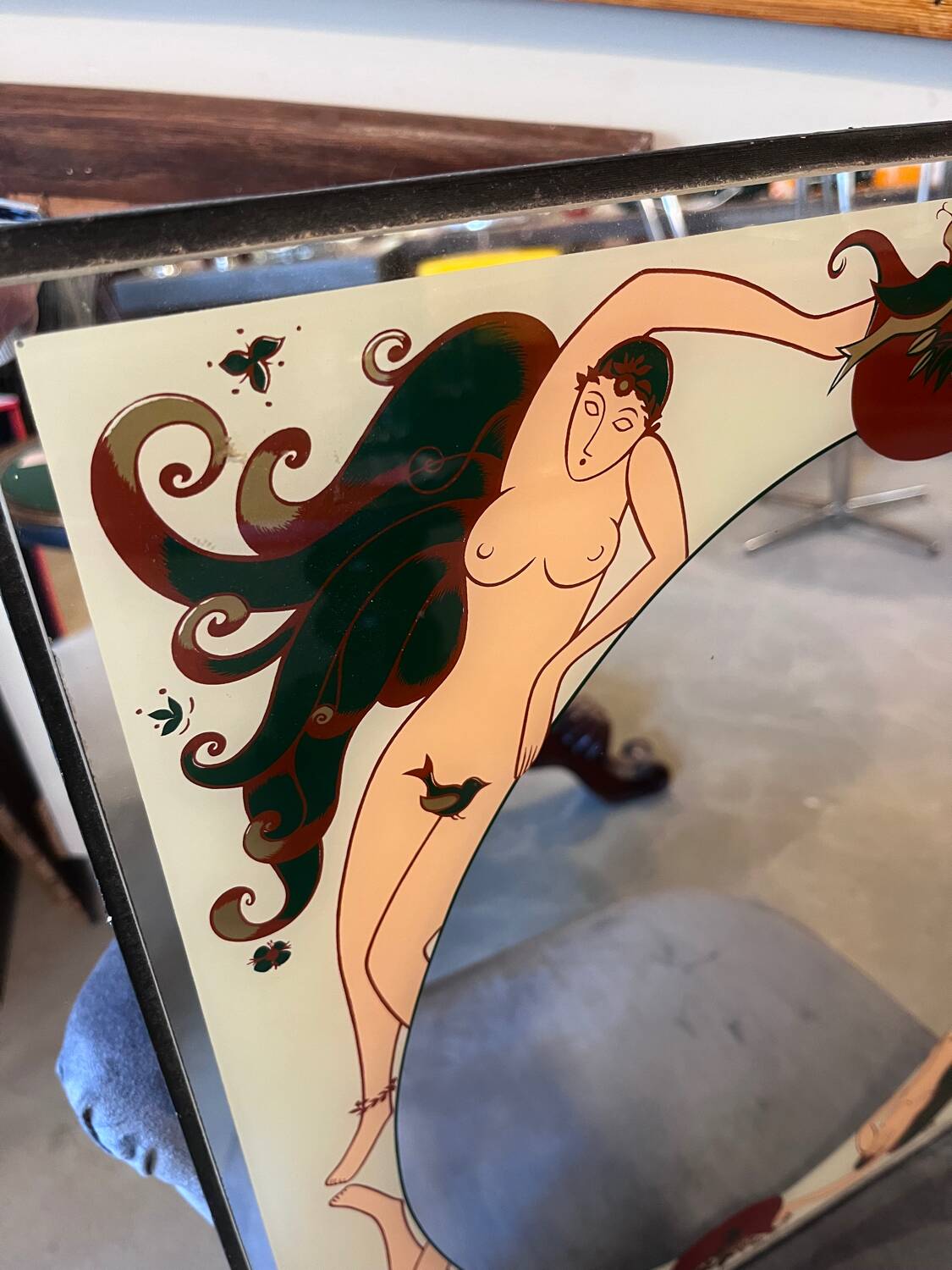 Art Deco style glass mirror, decorated upside down with nude women, signed