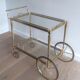 Brass rolling table from the Baguès house.