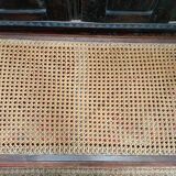 Wooden bench or piano bench with tanned seat