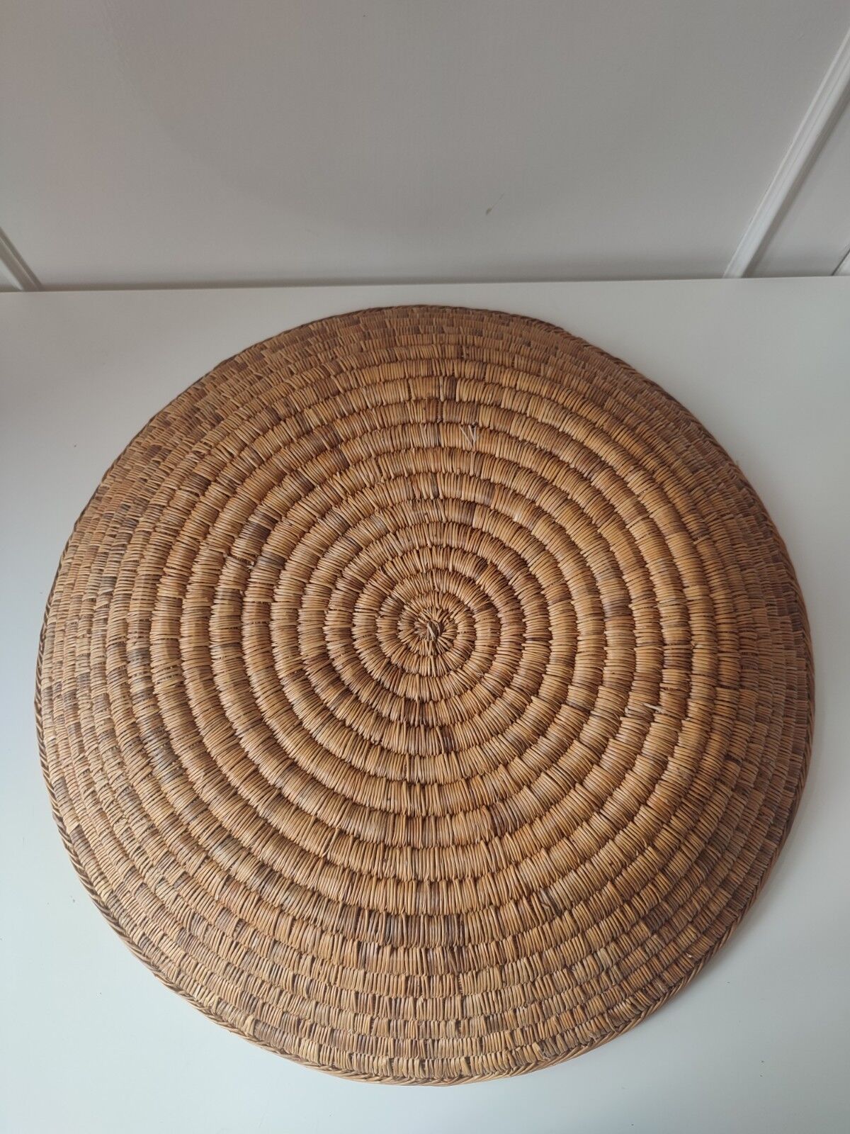 Ethnic plateau in woven palm leaf