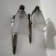 Silver Art Deco wall lights with frosted glass.