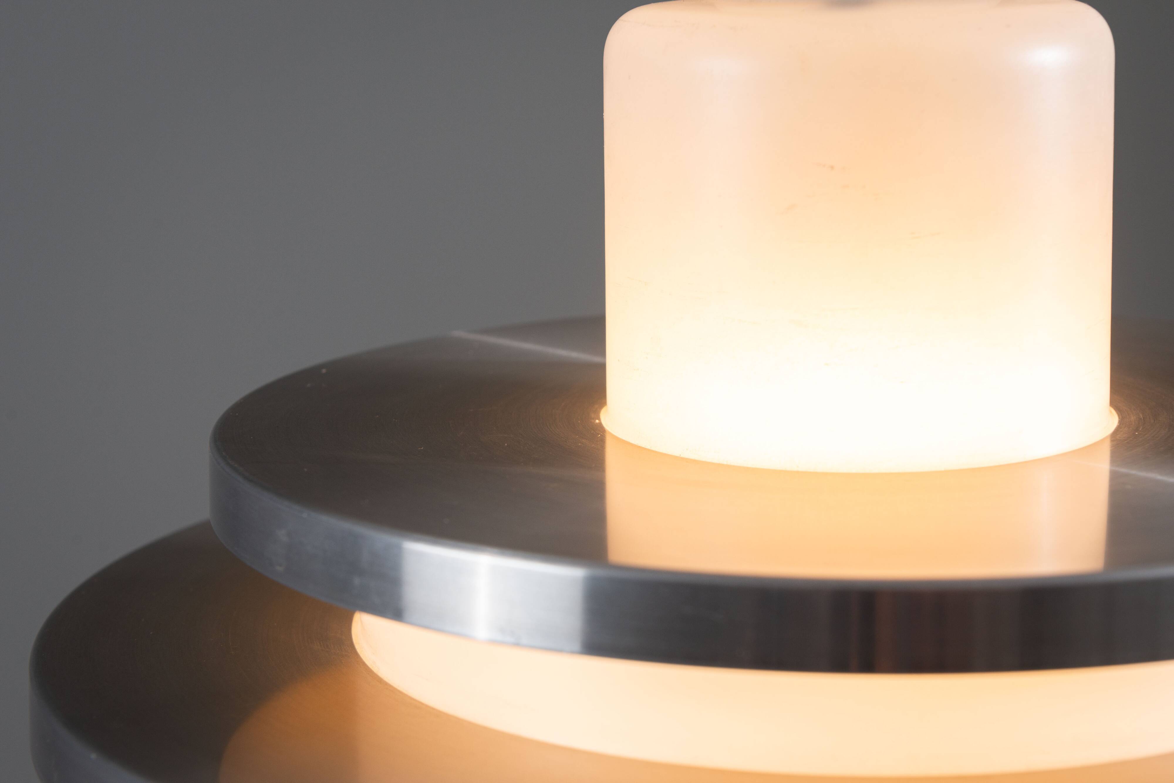 Doria pendant in opal glass with decorative aluminium discs