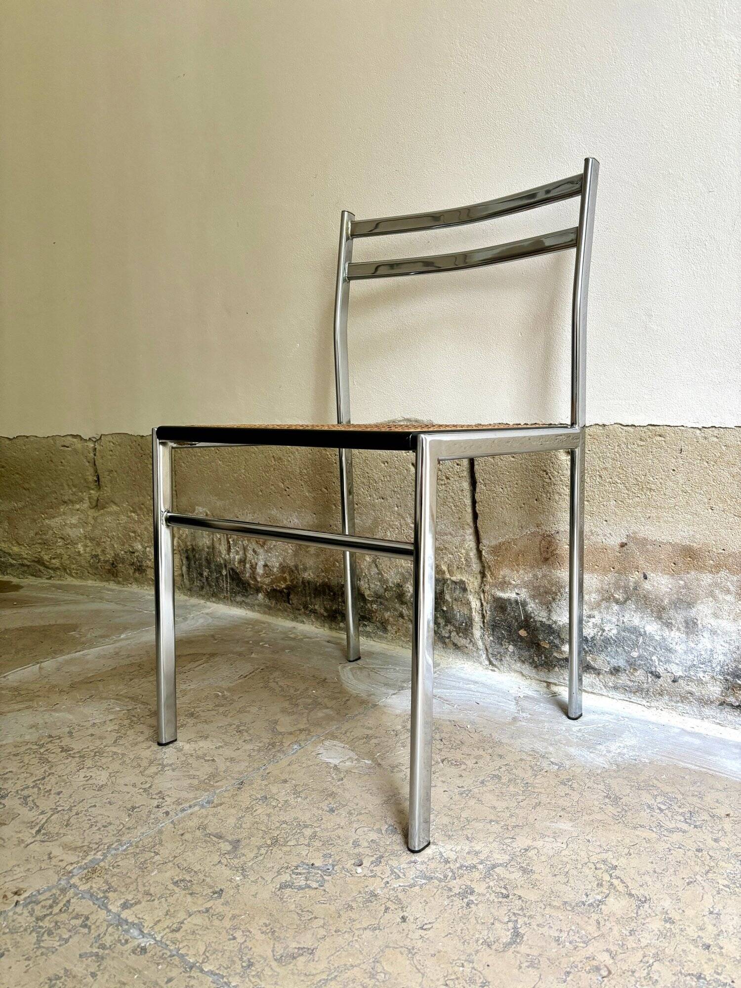 Chair in chrome metal, black wood and canework