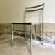 Chair in chrome metal, black wood and canework