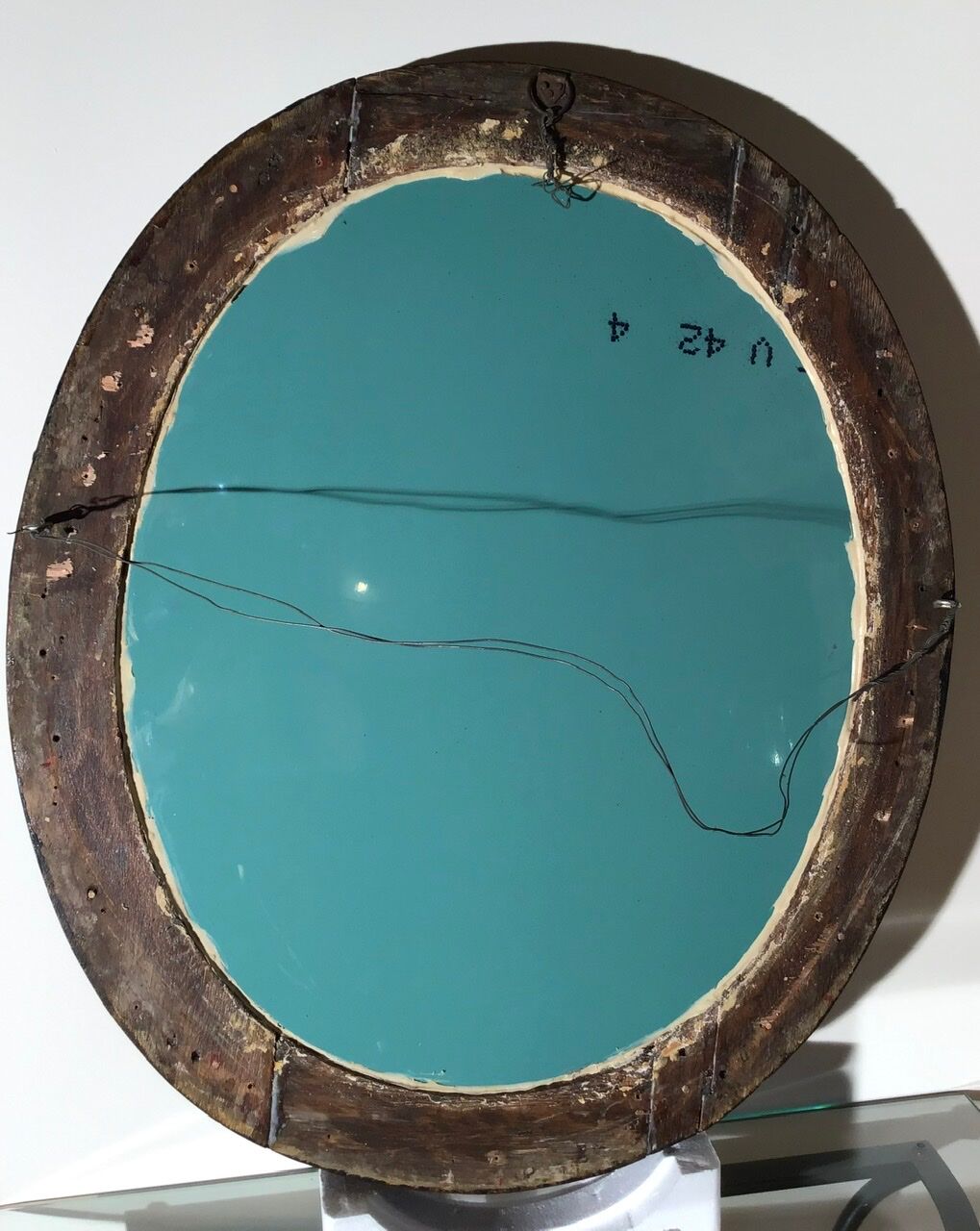 Oval mirror on an 18th century frame
