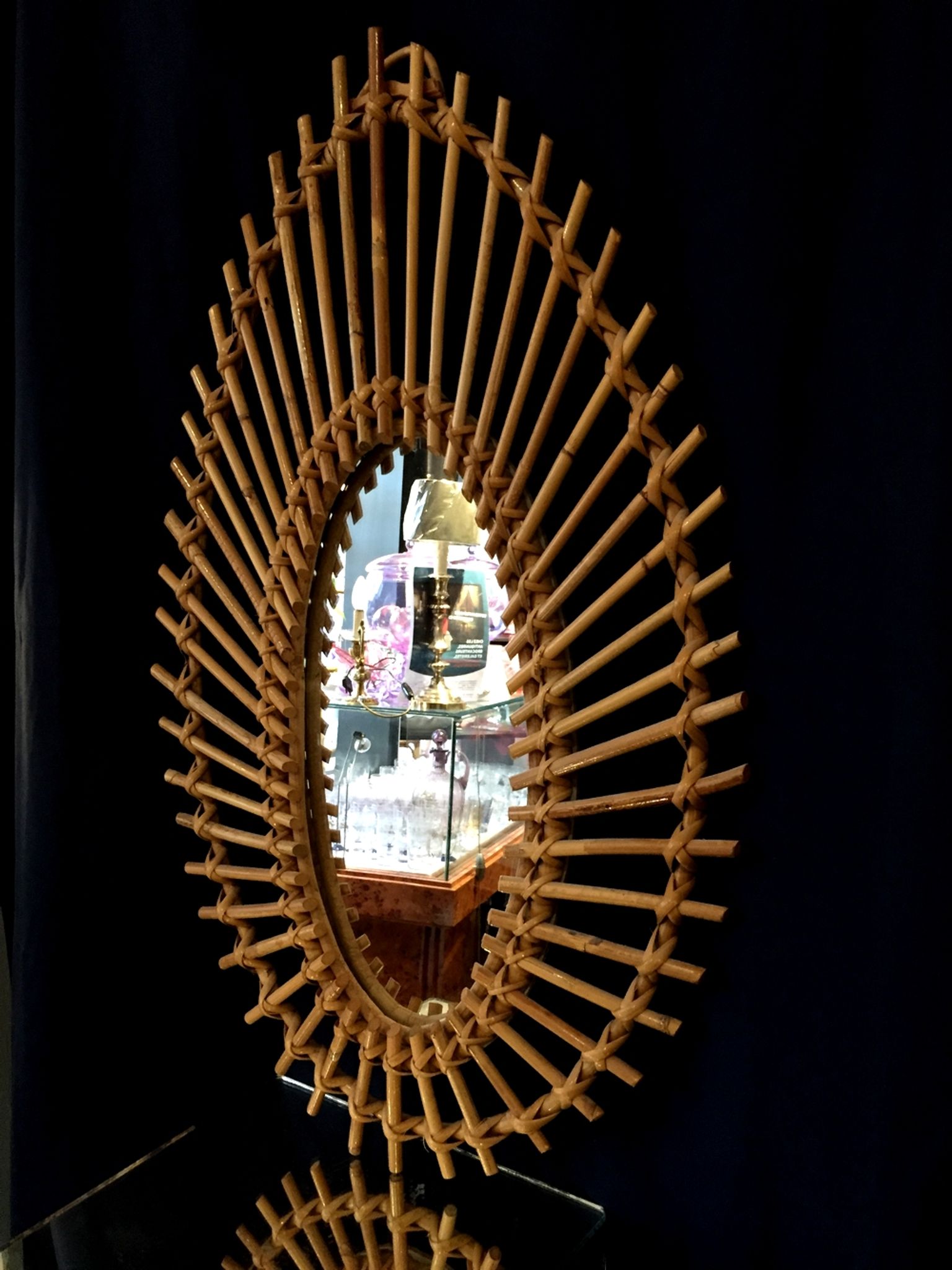 Oval shaped sun mirror in vintage rattan 1960/1970