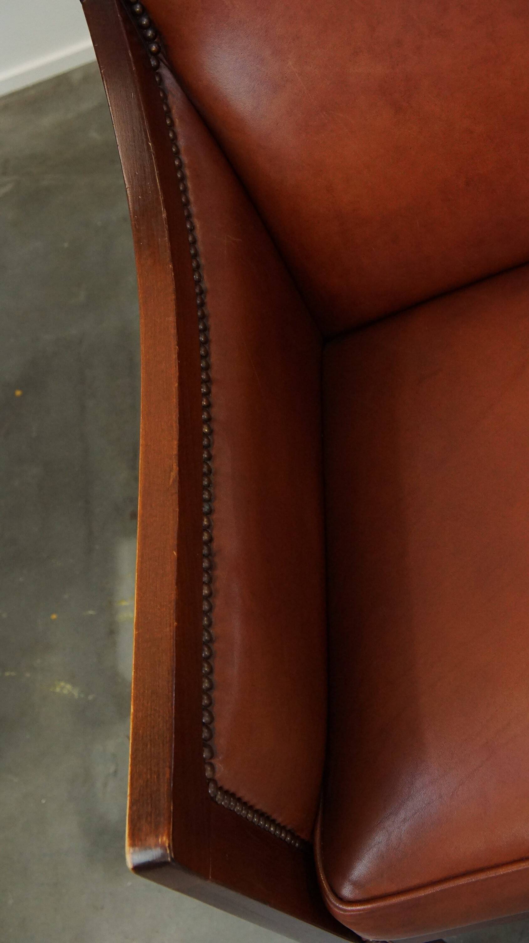 Ensemble majestueux et luxueux de 4 fauteuils design Art Déco en cuir de vachette couleur cognac