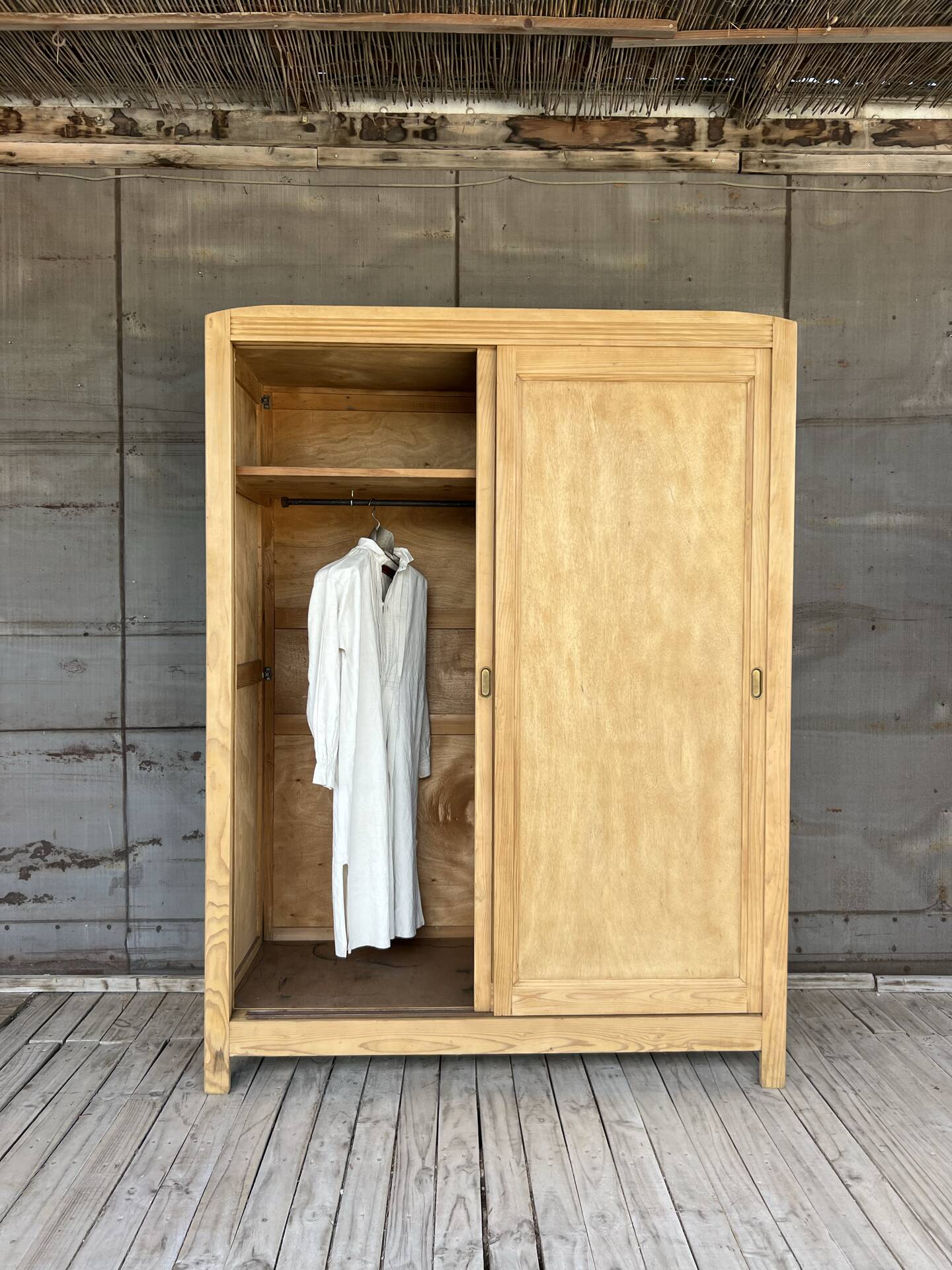 Sliding door wardrobe in raw wood