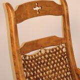 Vintage rocking chair in solid wood 1950
