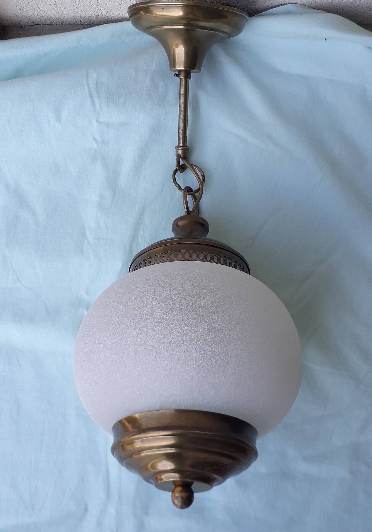 Glass and brass suspension