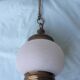 Glass and brass suspension