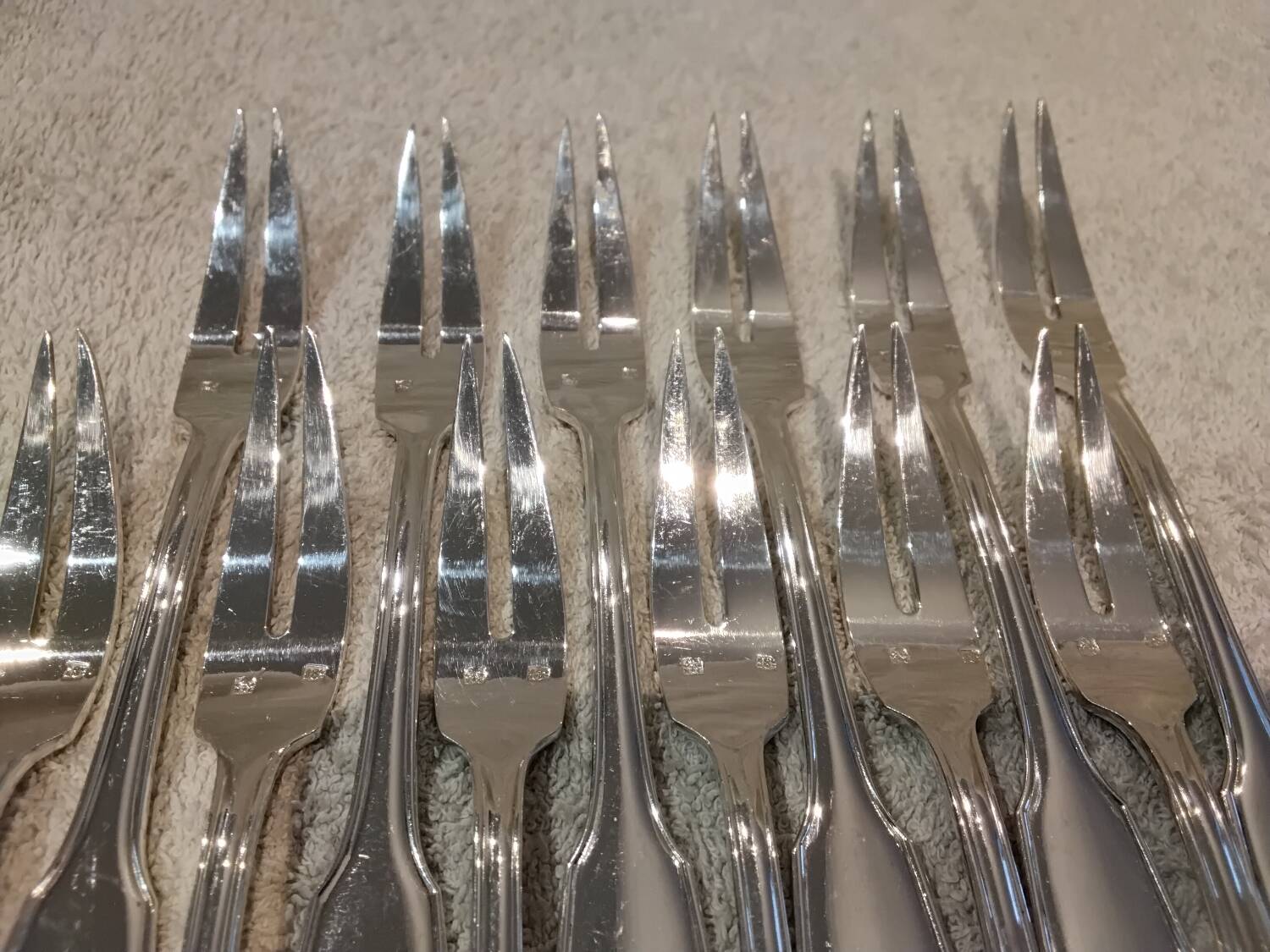 12 silver-plated metal snail forks by silversmith Noel Collet, shell design