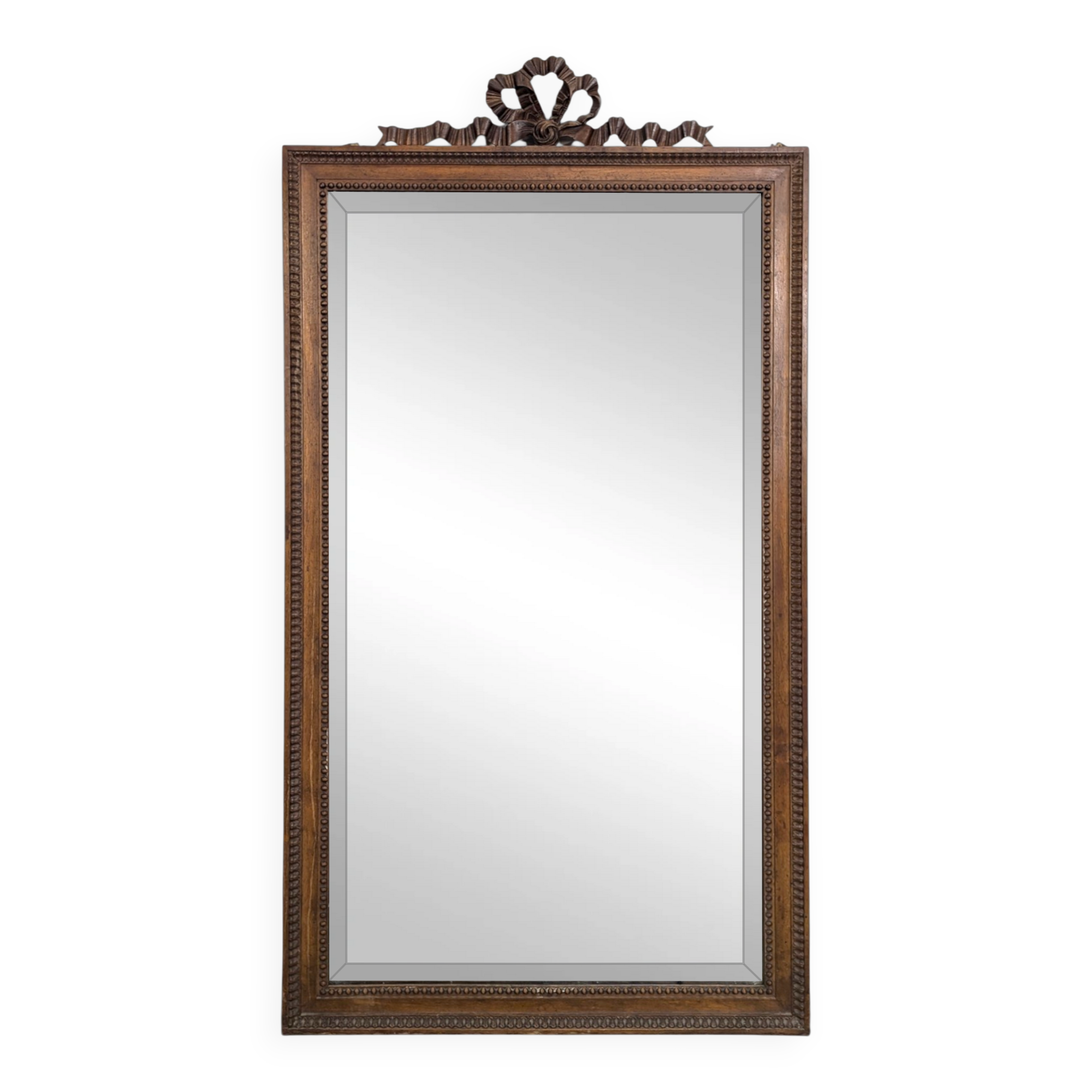 Louis XVI style mirror in carved walnut.