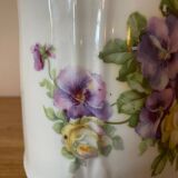 Old ceramic pitcher decorated with flowers