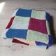 Hand knitted patchwork plaid